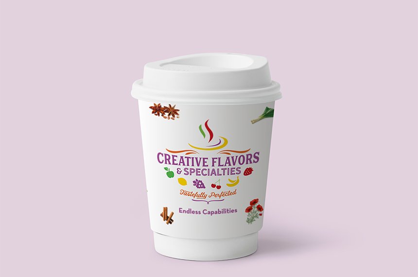 White 12 oz branded takeaway coffee cup with Creative Flavors & Specialties logo and spice graphics.
